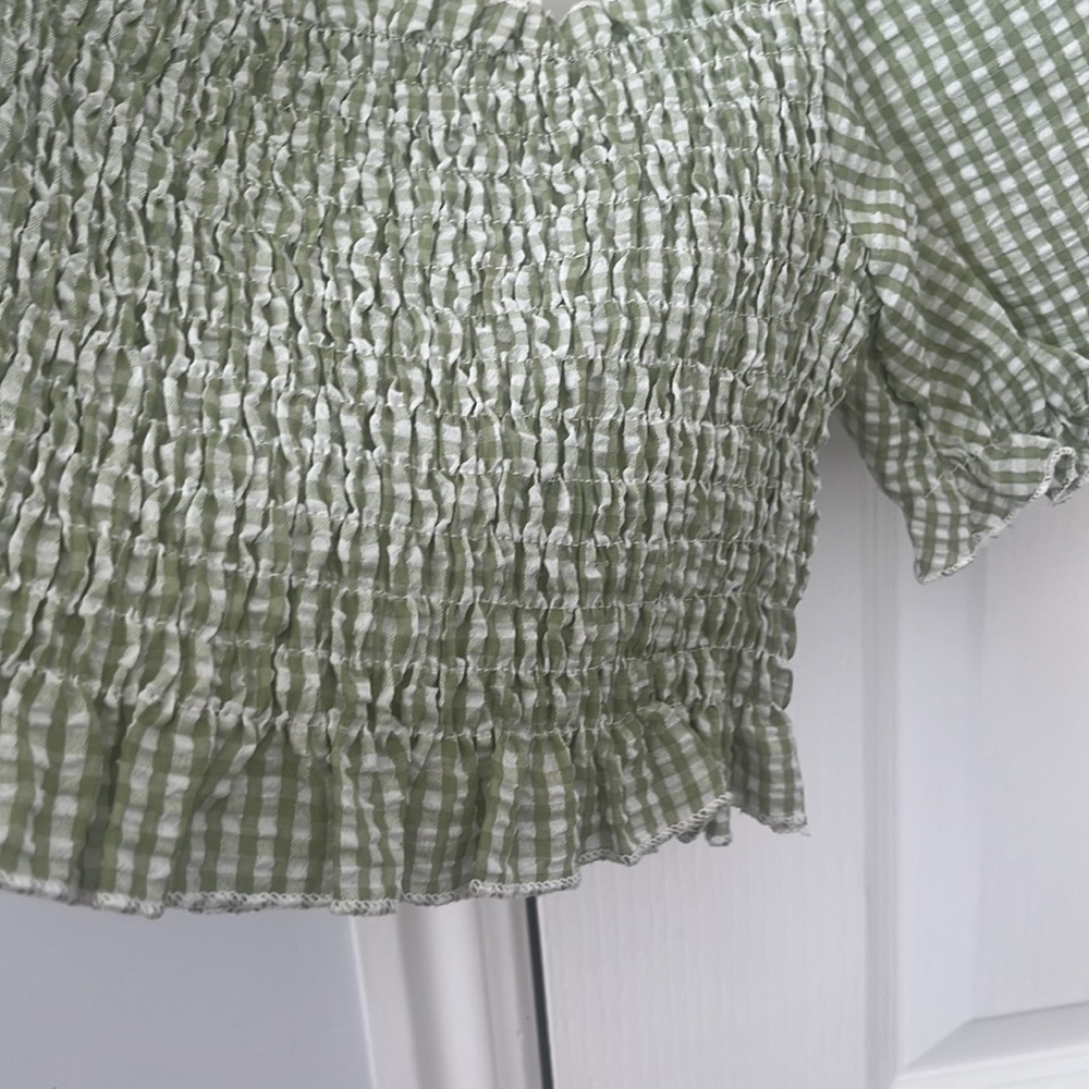 This blouse is from SHEIN in the size XS. The color contains a green & white - Picture 2 of 4